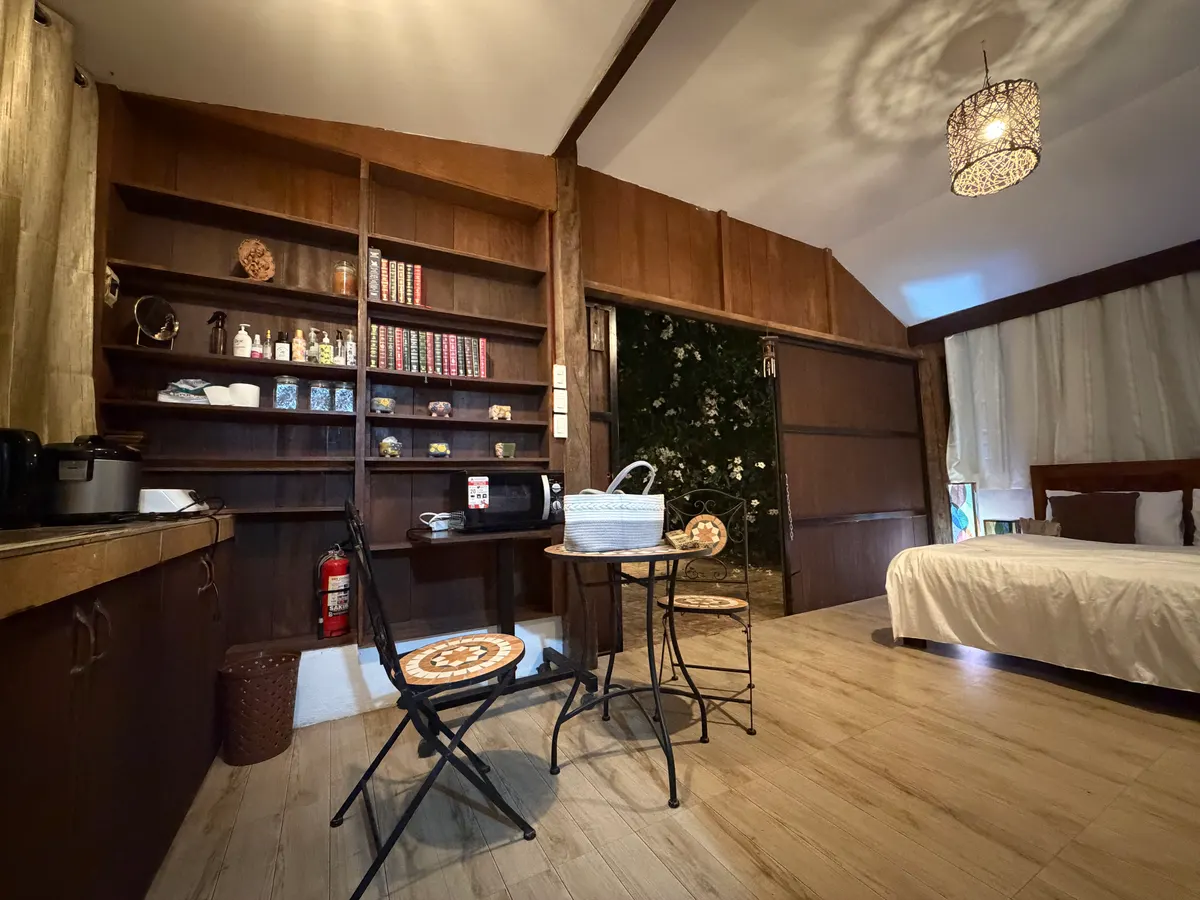 Small kitchenette with refrigerator inside the main cabin